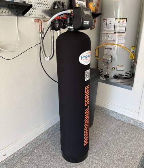 Water softener unit installed directly to the home's water tank